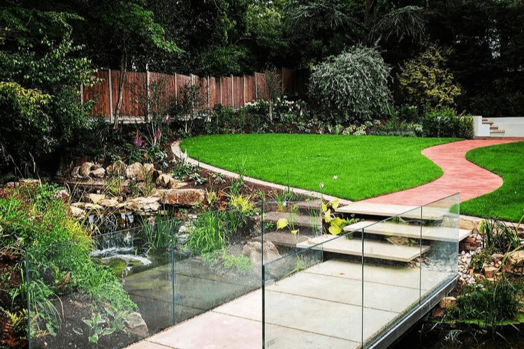 glass garden bridge spring garden inspiration mown path through meadow