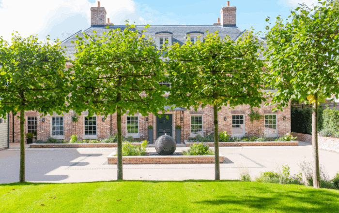 grand modern house with tree lined privacy