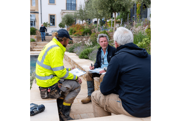 CGLA design and construction team reviewing landscape detailing and build coordination on site.