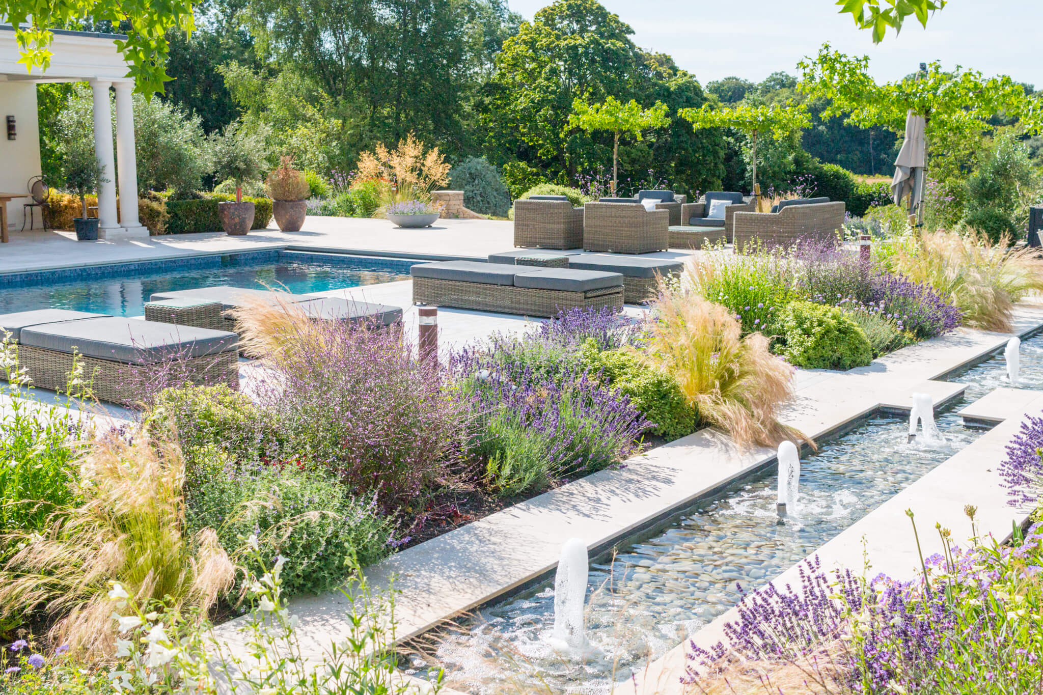 creative landscape design around a swimming pool